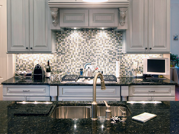 McGranite Countertops - Dark Kitchen Granite Countertop and Patterned Backsplash