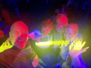 Also, here is a picture ofRob, Pam, Patti and Jen Dancing it up! The lights of the dance floor have made their faces all colors of the rainbow.