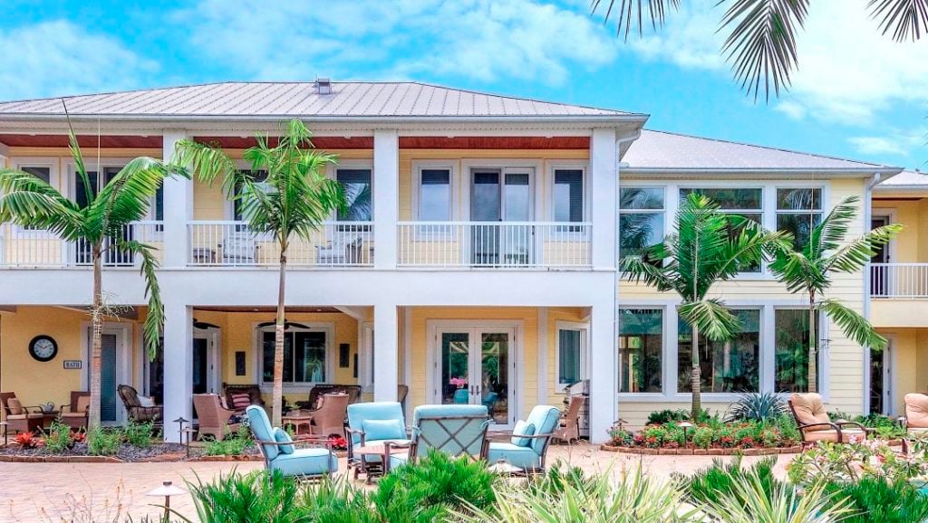 Use Montgomery Palms to bring a Fiji feel to your "Paradise". Furthermore, the house in the picture is a peach color.
