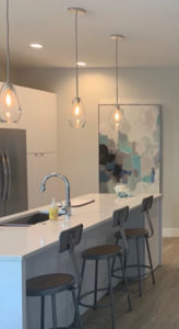 additionally, the gray stools at the counter did not add a happy factor. The cabinets and counter tops are white. It's the perfect Cabin Fever Project.