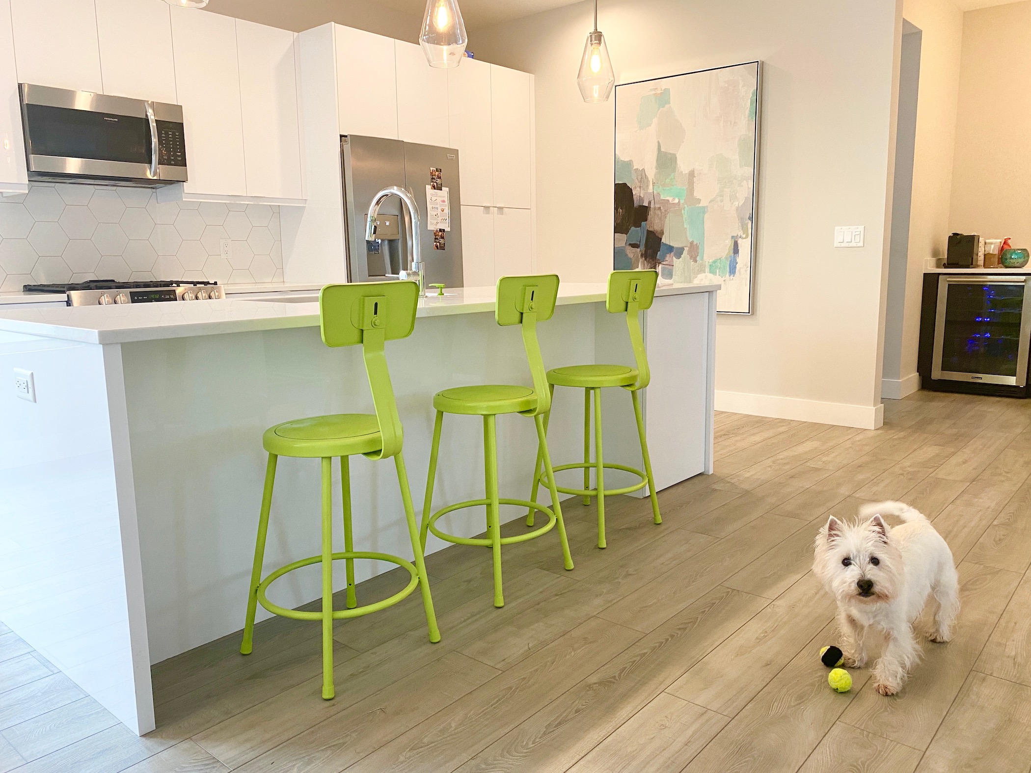 Also, the Chartreuse Color on the Stools makes the room happier. The counter and cabinets are white.