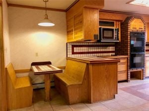 Breakfast nook with bench seats and tile counters